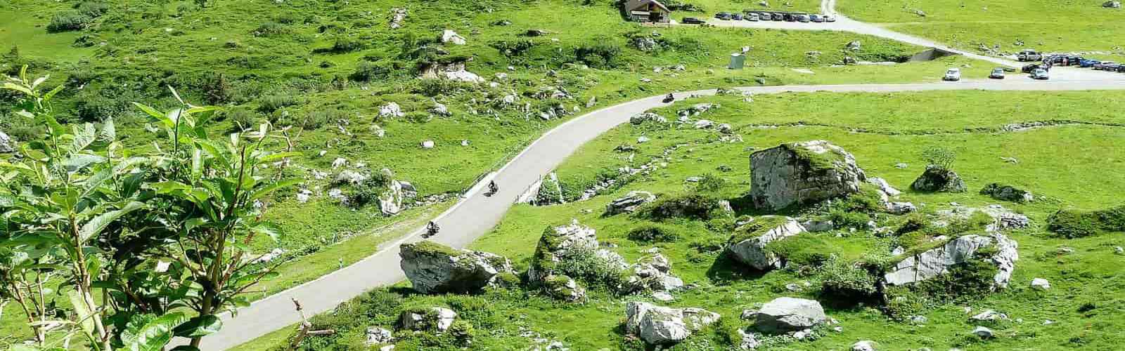 Motorcycle tour on the winding road to Sella pass, Dolomites